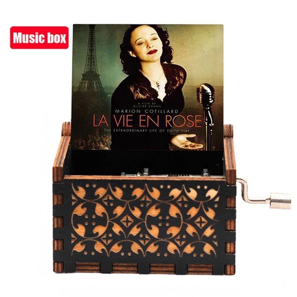 Antique wooden hand crank music box featuring a portrait of Marion Cotillard.
