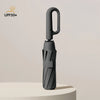 A black windproof automatic folding umbrella with a curved handle is shown against a light background.