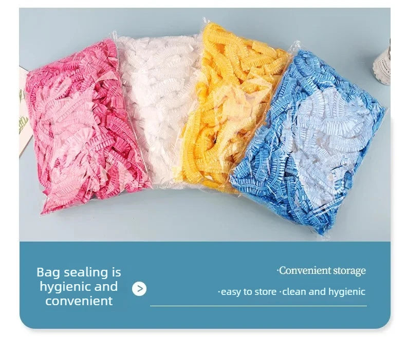 A pile of colorful, fluffy reusable transparent shower caps in pink, white, yellow, and blue.