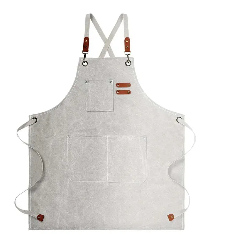 A light gray oil-proof canvas apron with straps and utility pockets.