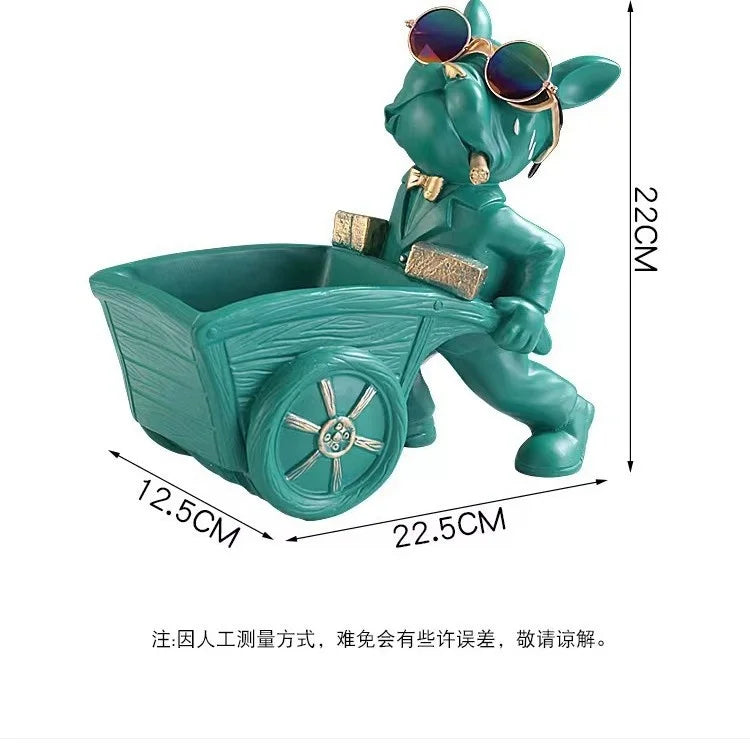 A teal French bulldog sculpture designed as a coin bank and snack holder.