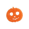 An orange textured sponge shaped like a carved pumpkin face.