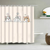 A shower curtain featuring cute cartoon cats with speech bubbles.