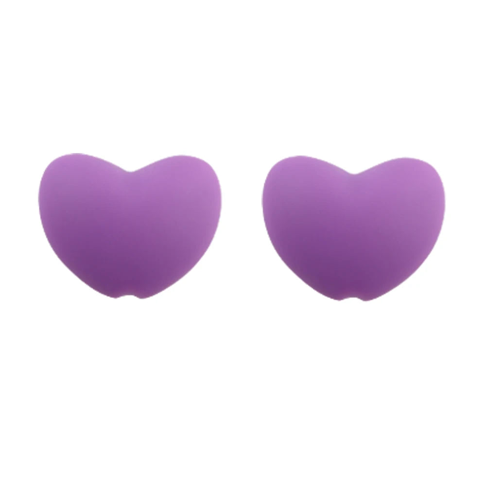 A pair of purple silicone heart charm beads for DIY jewelry.