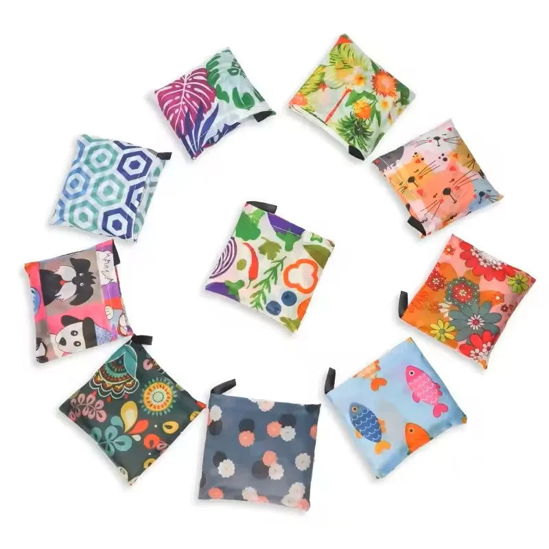 A collection of nine foldable tote bags featuring various colorful leopard print and floral patterns arranged in a circle.