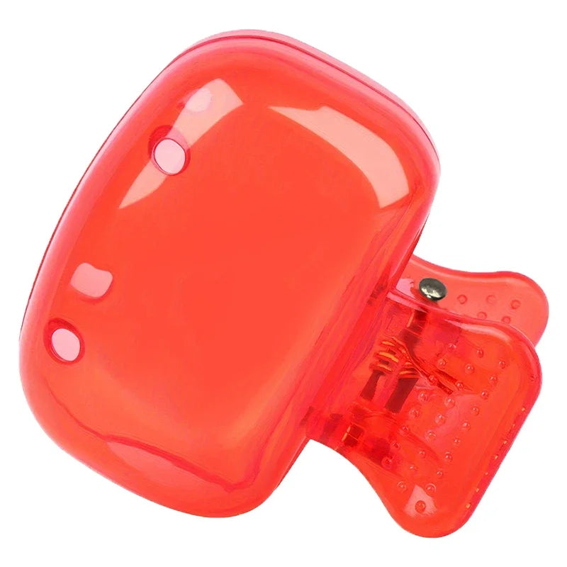 A clear red protective cap designed for toothbrush holders.