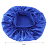 A royal blue satin wide-brim sleeping bonnet for hair care, shown flat.