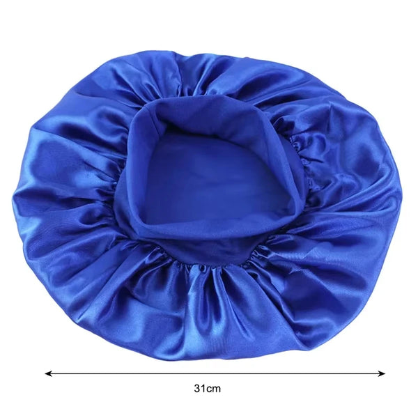 A royal blue satin wide-brim sleeping bonnet for hair care, shown flat.