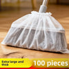 A white disposable electrostatic broom cover made of sheer fabric, shown on a wooden floor.