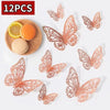 Twelve intricately cut, reddish-orange paper or cardstock butterflies displayed on a white background.