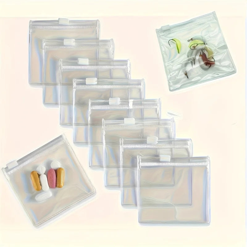 A collection of clear, resealable plastic organizer bags for portable travel medicine with separate compartments.
