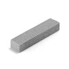 A rectangular gray pumice stone cleaning stick used for stain removal.