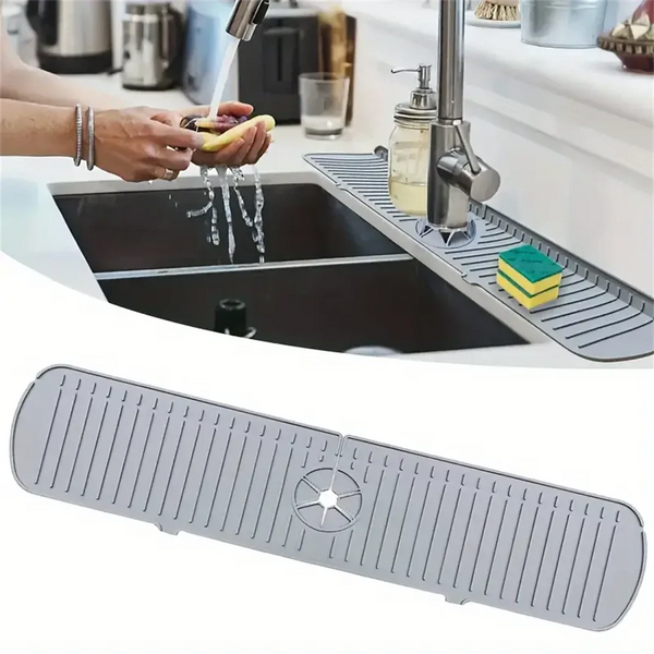 A silicone sink drain mat is shown installed in a kitchen sink, draining water into a collection area.