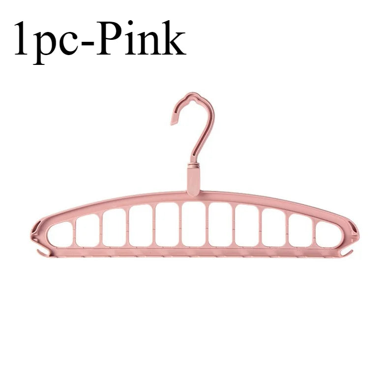 A single pink foldable multi-hole space-saving laundry drying rack.