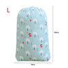 Light blue drawstring storage bag featuring a pattern of white trees and small red figures.