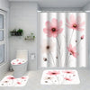 A shower curtain featuring pink peony floral patterns and a bath mat with matching designs.