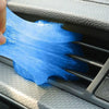 A hand is applying a blue, translucent gel to a grille or vent using a silicone applicator.