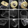 A clear glass apothecary jar dispenser with a golden lid, showing various angles of the product.