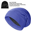 A purple satin sleep bonnet is shown, featuring a black lining and a smooth texture.