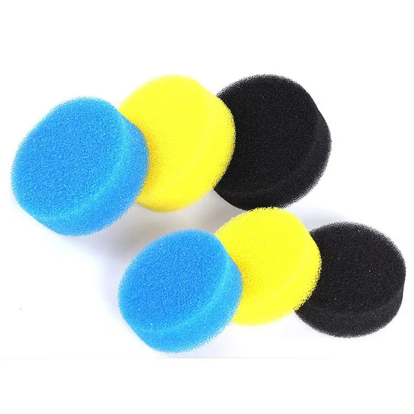 Four replacement filter media discs in blue, yellow, and black colors.