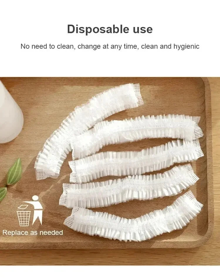 White disposable shower caps for hair protection laid out on a wooden board.