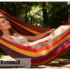 A woman relaxing in a colorful hammock outdoors, advertised with a 40% off sale.