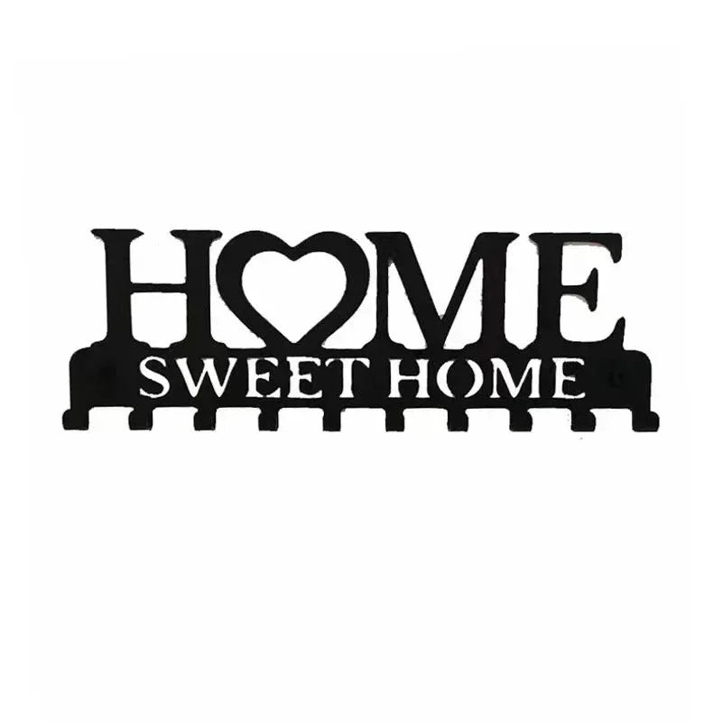 Black rustic iron key holder wall art with the words HOME and SWEET HOME carved into the design