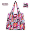 Wiederverwendbare Tasche mit niedlichem Hundegesichtsdesign in rosa und grauen Tönen.