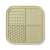 A beige silicone lick mat designed for dogs and cats with various textured patterns.