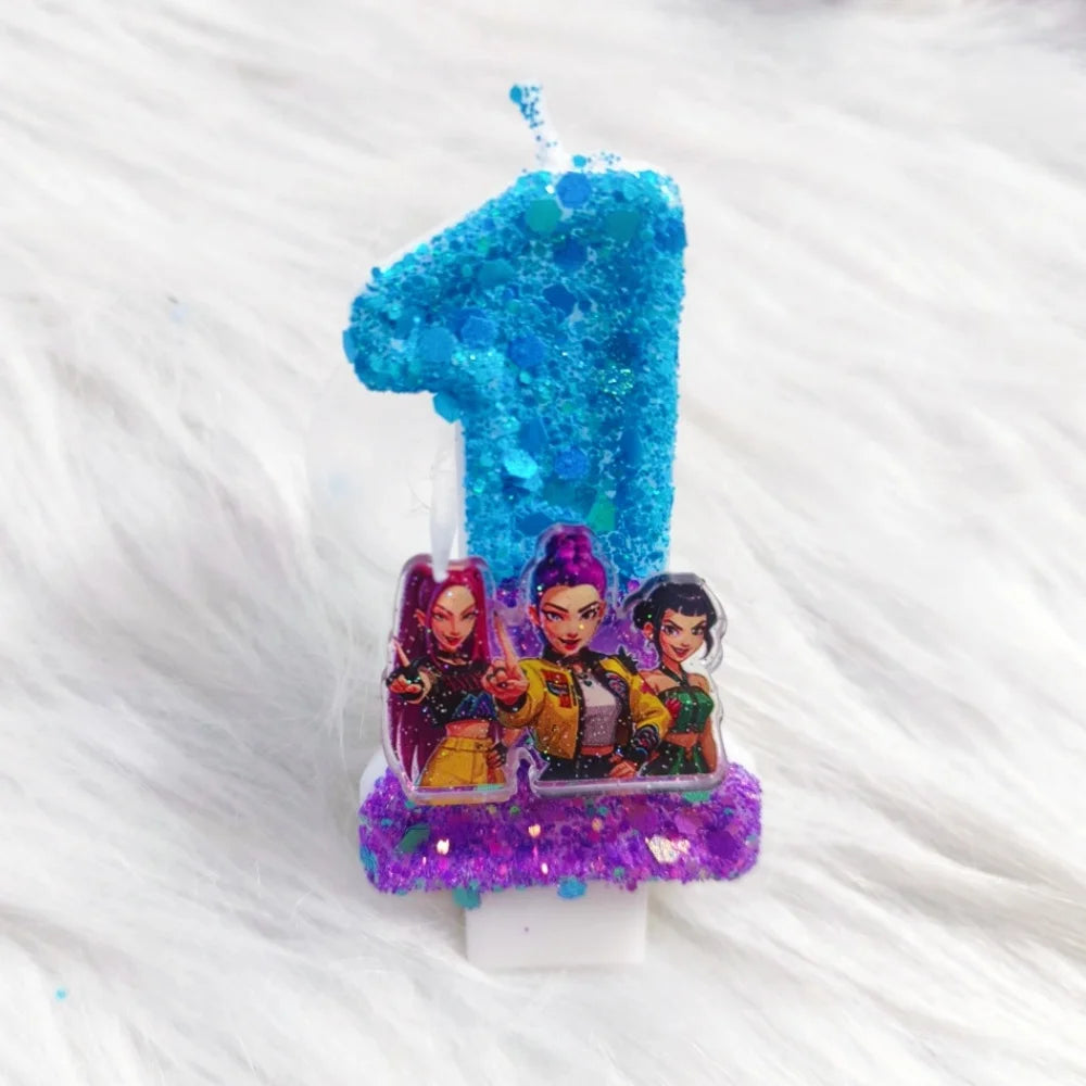 A birthday candle shaped like the number one made of blue glitter and purple confetti