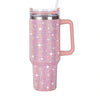 Taza aislada de acero inoxidable con strass rosas y tapa transparente y asa.