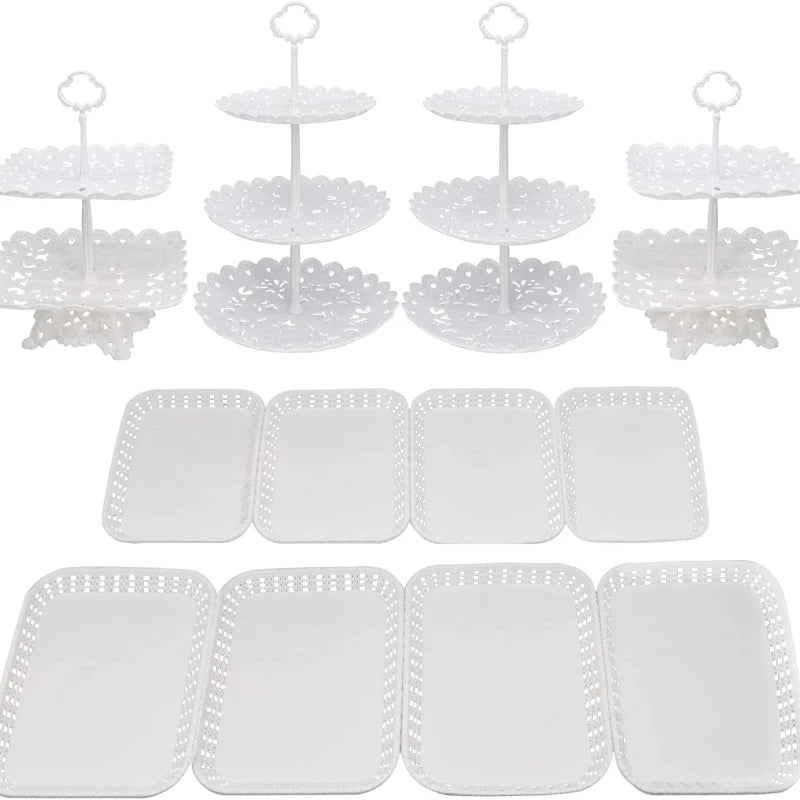 White plastic dessert stands with various tiers and plates for fruit and candy