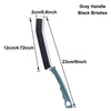 A long, narrow crevice cleaning brush with a gray handle and black bristles.