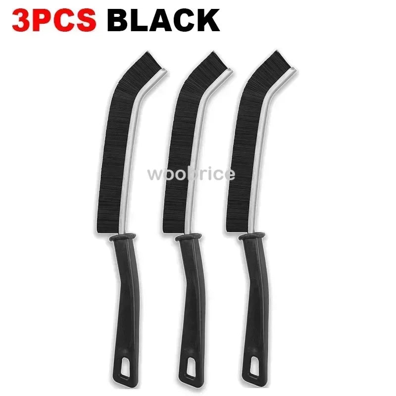 Three black multifunctional hard bristle crevice cleaning brushes.