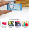 A hand holds a blue portable mini wipe product packaging with instructions for use.