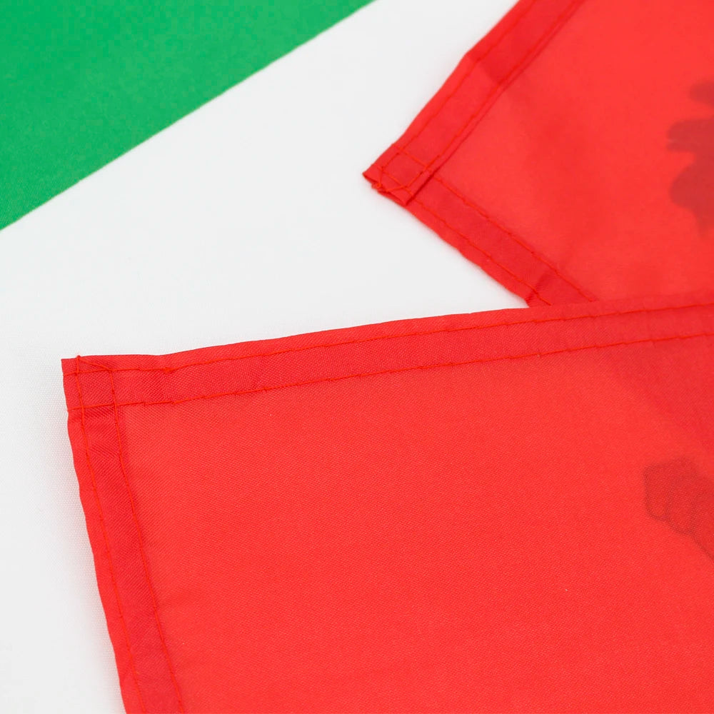 Red and green fabric flags displayed against a white background.