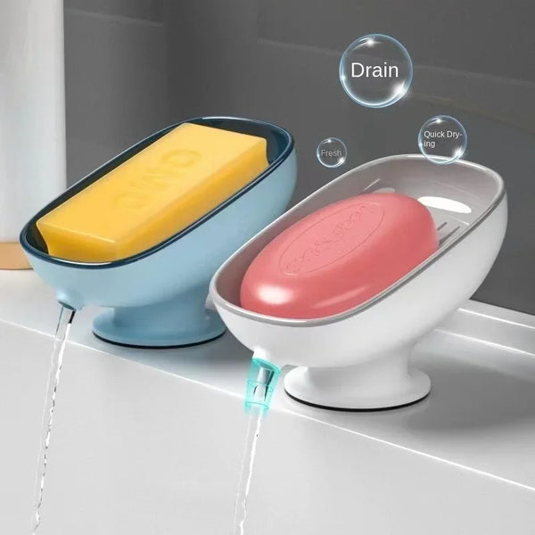 A heavy duty suction cup soap dish with a yellow bar of soap is shown draining water.