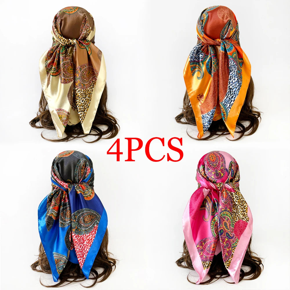 Four women's square paisley print scarves in various colors and patterns displayed on a white background.