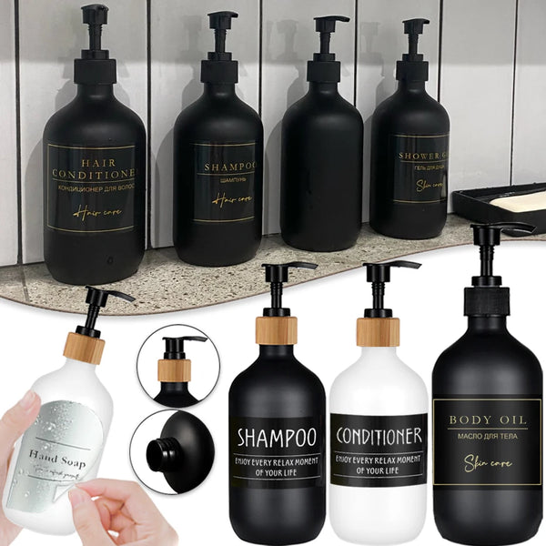 A collection of black and white refillable bottles for hair, body, and shower products.