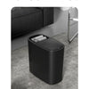 A black odor-sealing trash can with a press lid is shown on a gray carpet.