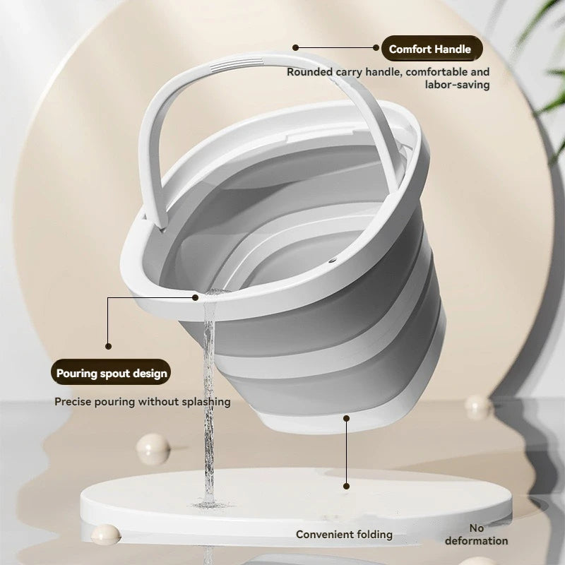 A white foldable plastic bucket with a rounded carry handle and pouring spout design shown on a stand.