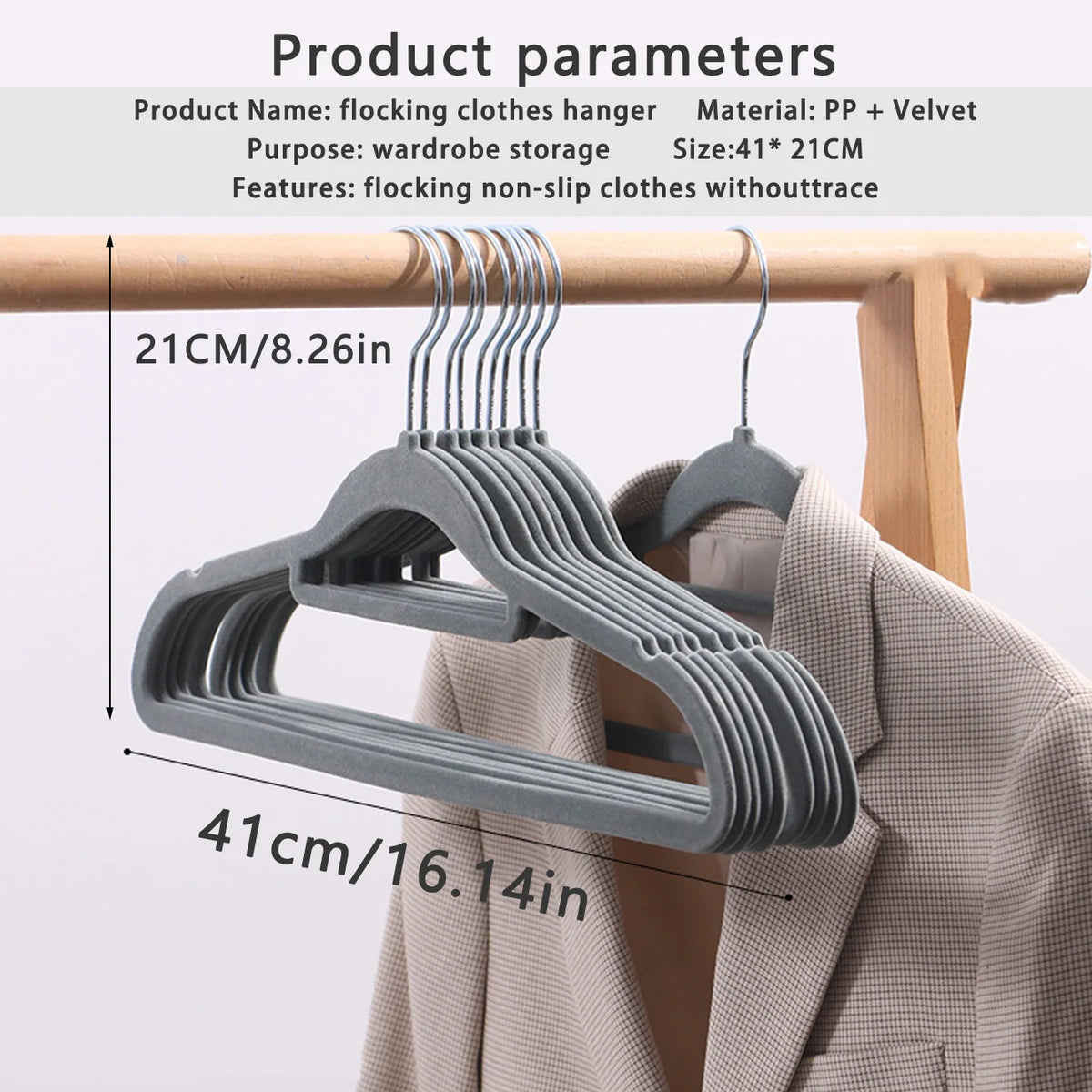 A set of gray plastic flocking clothes hangers displayed on a wooden rack.
