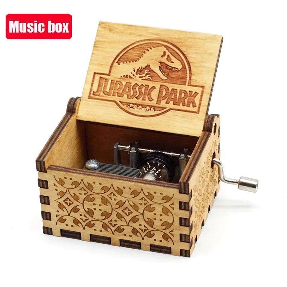 An antique wooden music box with a Jurassic Park theme featuring an engraved lid and decorative wood paneling.