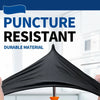 Black puncture resistant durable material umbrella or canopy being held.