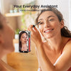 A woman is using a silicone suction cup phone mount for hands-free makeup application.