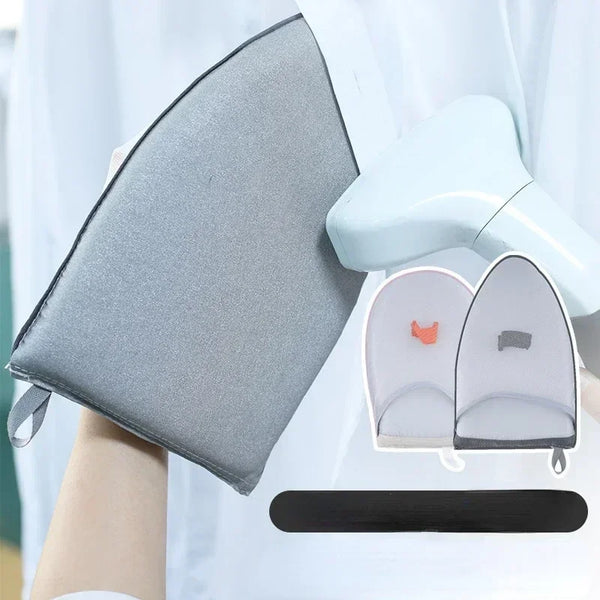 Una tabla de planchar y una vaporizadora de ropa siendo usadas para vaporizar una tela.