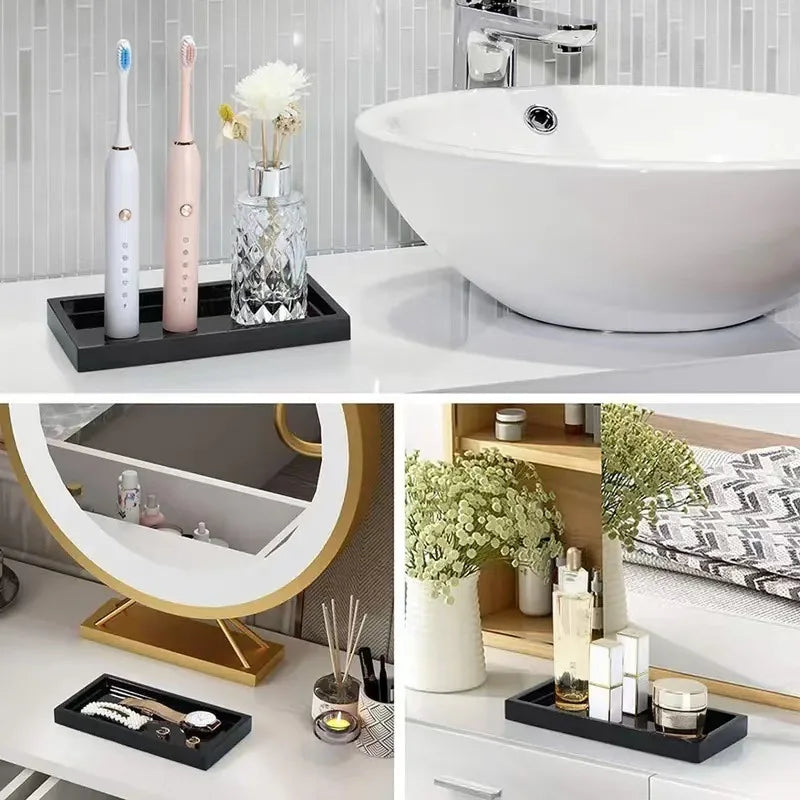 A silicone tray organizer set with various silicone and wooden trays is displayed on a white vanity surface.
