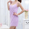 A woman models a lavender ultra-absorbent quick-drying bath wrap towel dress.