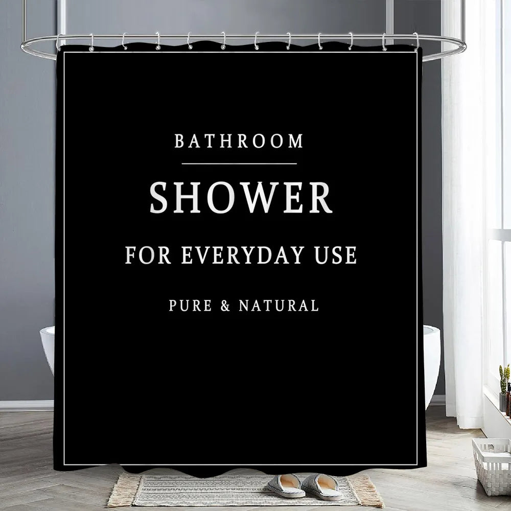 Black sign with white text reading Bathroom Shower for Everyday Use Pure & Natural hanging from a metal rod