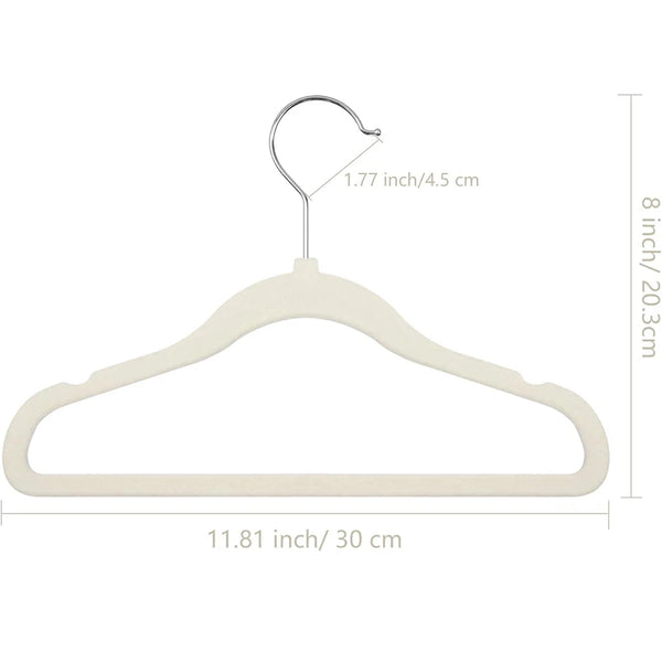 A beige velvet hanger with a metal hook and a curved shape for clothing.